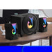 Black speaker system with colorful LED lights on a wooden table