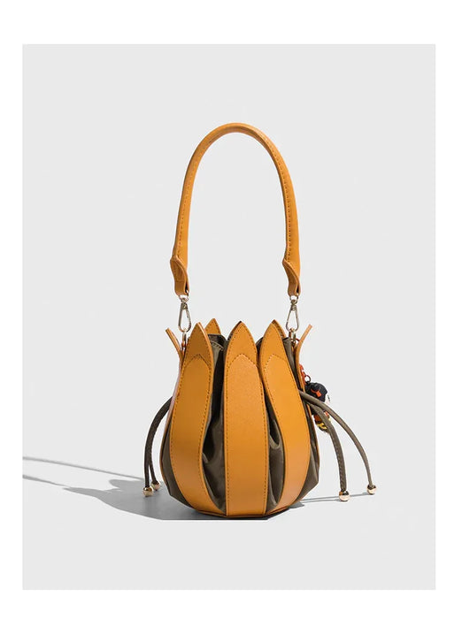 Yellow handbag with unique design on a white background