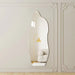 Decorative wall mirror on a wall with ornate molding