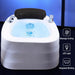 Foot massage basin with LED light and water features on a dark background