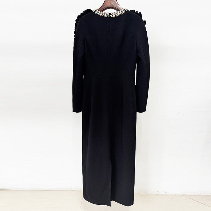 Black long-sleeve dress on a white background