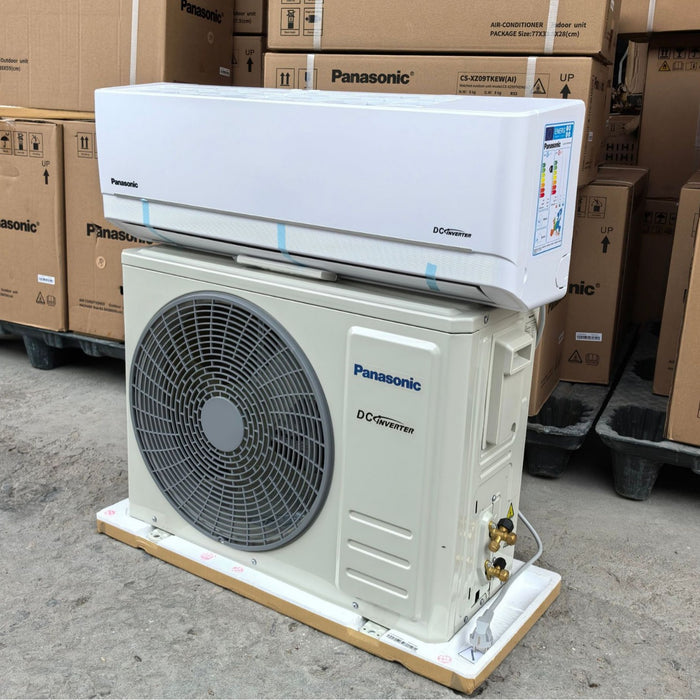 Panasonic air conditioning unit on a pallet with cardboard boxes in the background