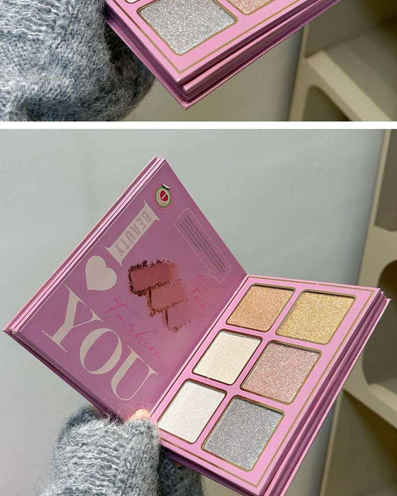Makeup palette with glittery shades and 'I ❤️ U ❤️' text on a pink case.