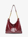 Red handbag with a gold chain strap on a white background
