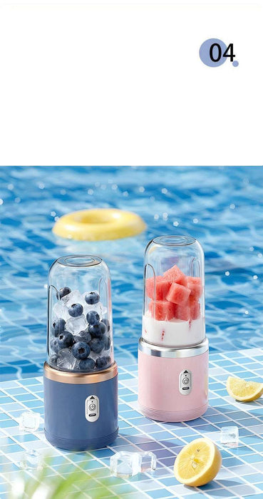 Two portable blenders, one blue and one pink, on a blue water background with fruits and lemons.