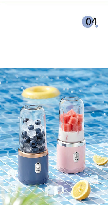 Two portable blenders, one blue and one pink, on a blue water background with fruits and lemons.
