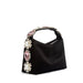 Black handbag with decorative gemstones on a white background