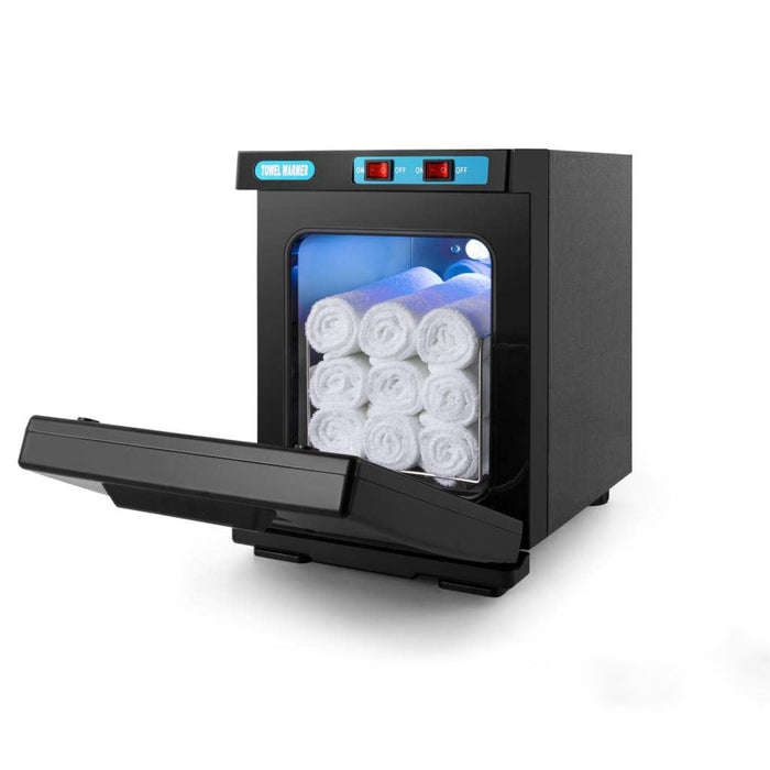 Black dental sterilizer with rolls of white material inside on a white background