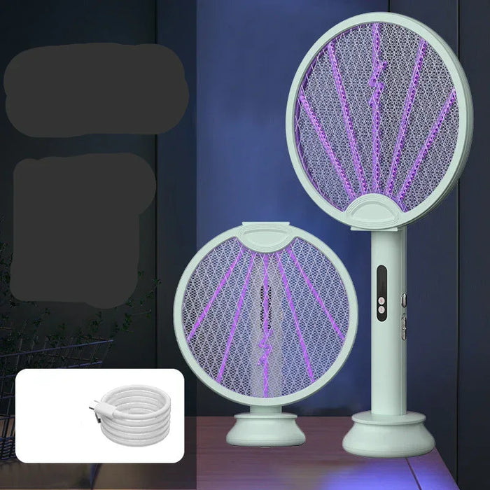 Electric fly swatter with purple light on a dark background