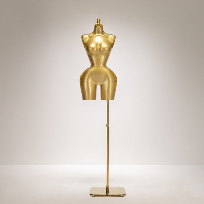 Gold mannequin lamp on a plain background