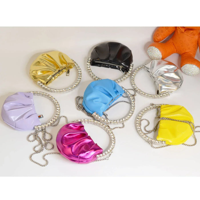Colorful plastic bags with chains on a white background