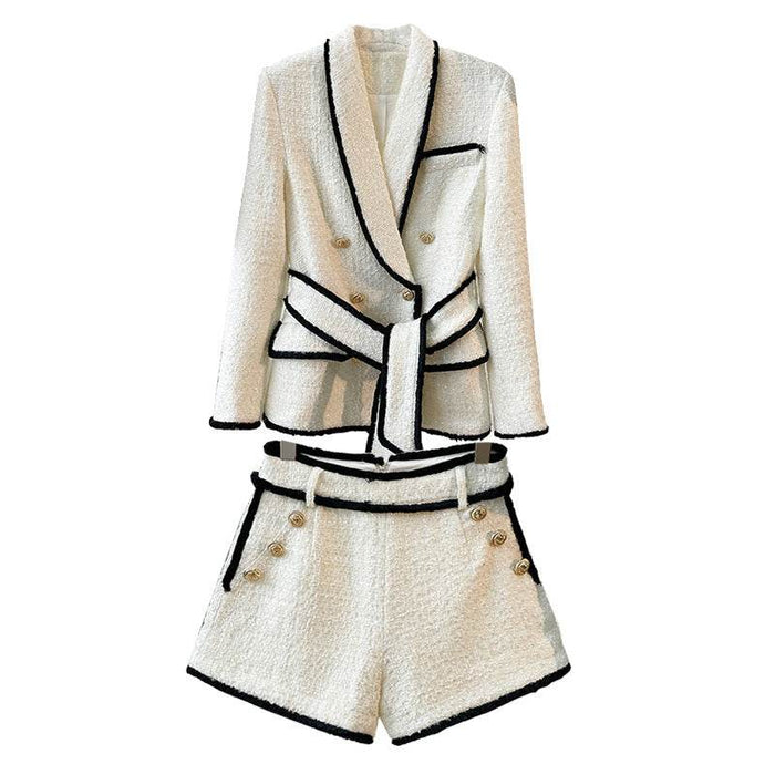White blazer and shorts set with black trim on a white background