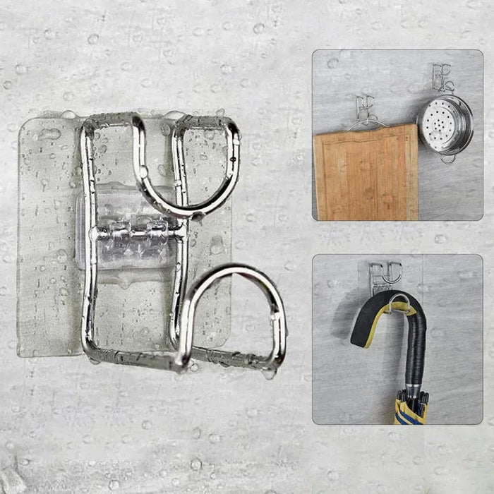 Metal wall hooks on a concrete wall with various items attached.