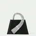 Black handbag with a silver, ribbed handle on a white background