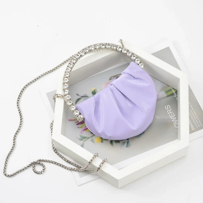 Purple handbag with a chain strap on a white background
