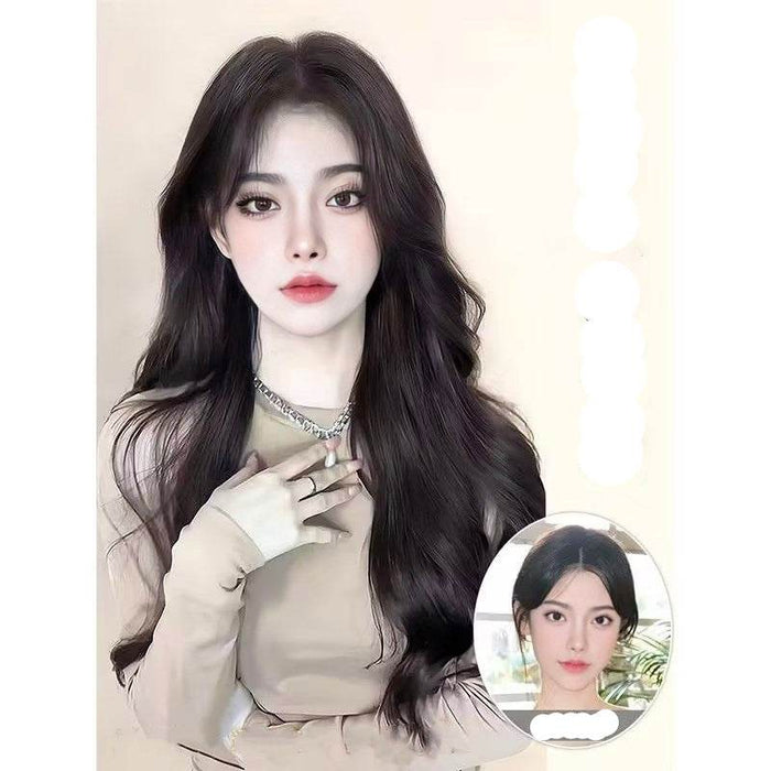 Woman with long, wavy hair wearing a beige top on a plain background