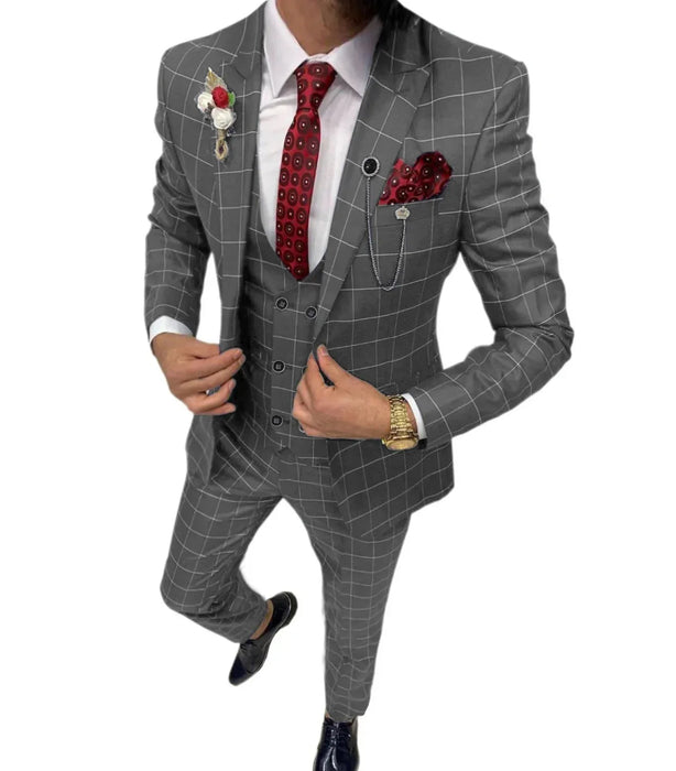 Gray checkered suit with red tie and pocket square on a white background