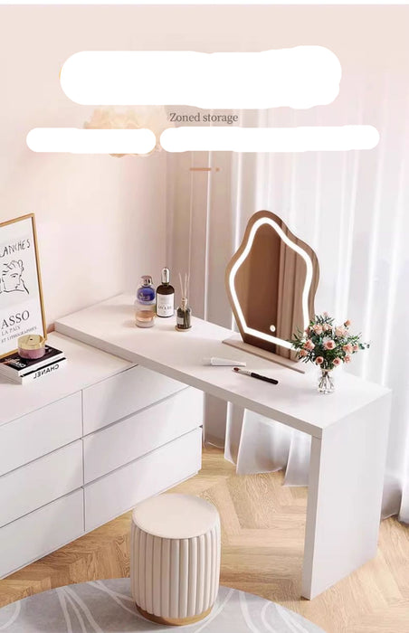 Modern white desk with mirror and decorative items in a room setting