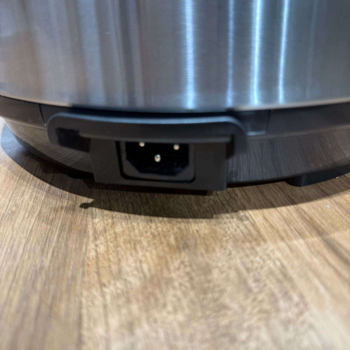 Close-up of a robot vacuum cleaner on a wooden floor