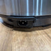 Close-up of a robot vacuum cleaner on a wooden floor