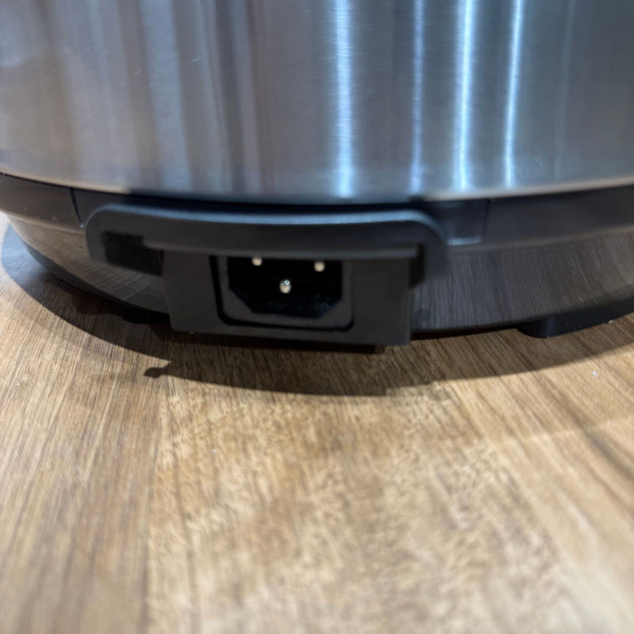 Close-up of a robot vacuum cleaner on a wooden floor