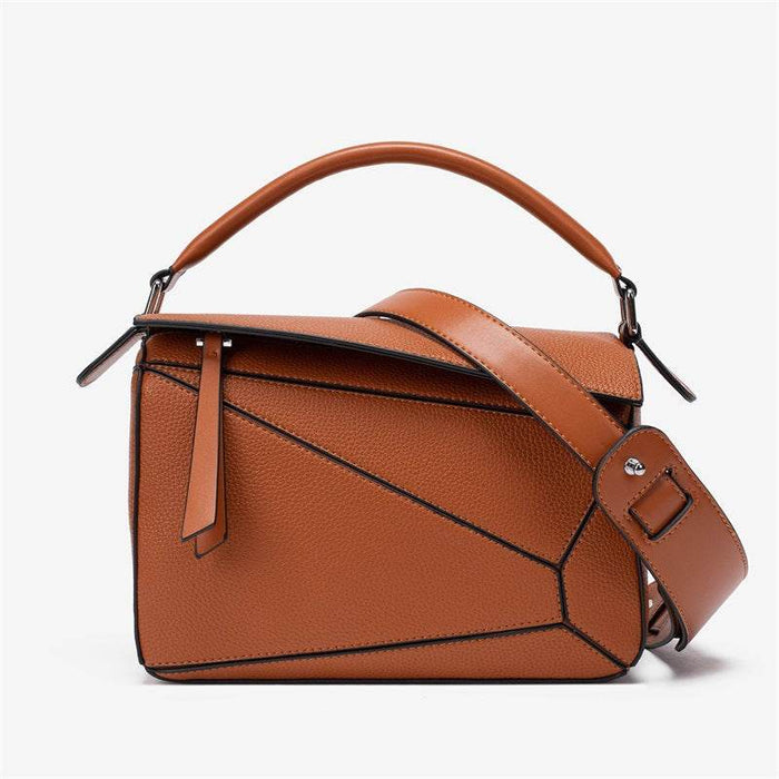 Brown leather handbag with a geometric design on a white background