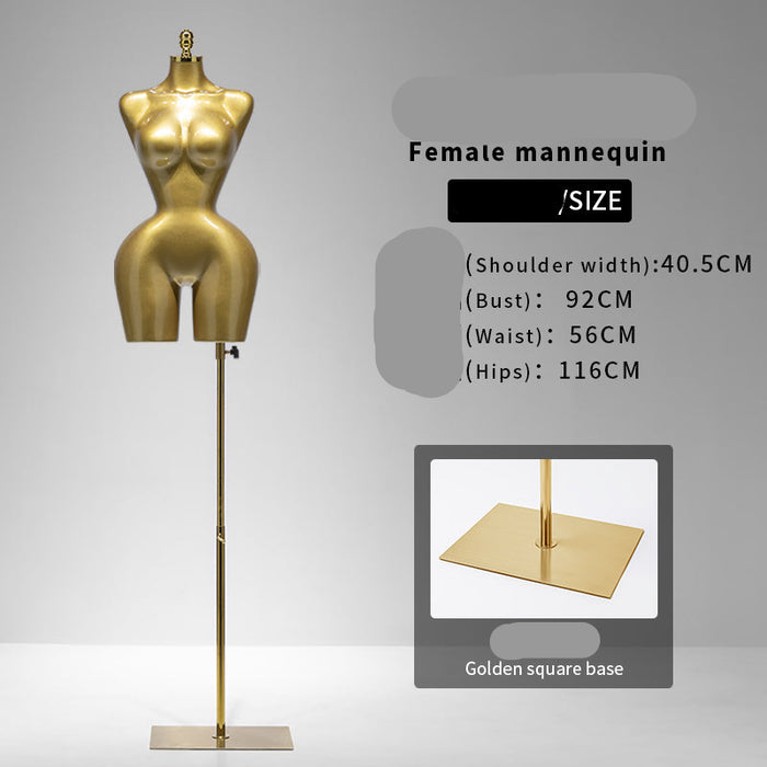 Gold female mannequin with size information on a gray background