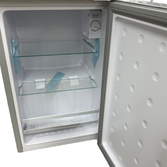 Empty refrigerator with open door on a white background