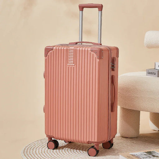 Pink suitcase with wheels on a beige background
