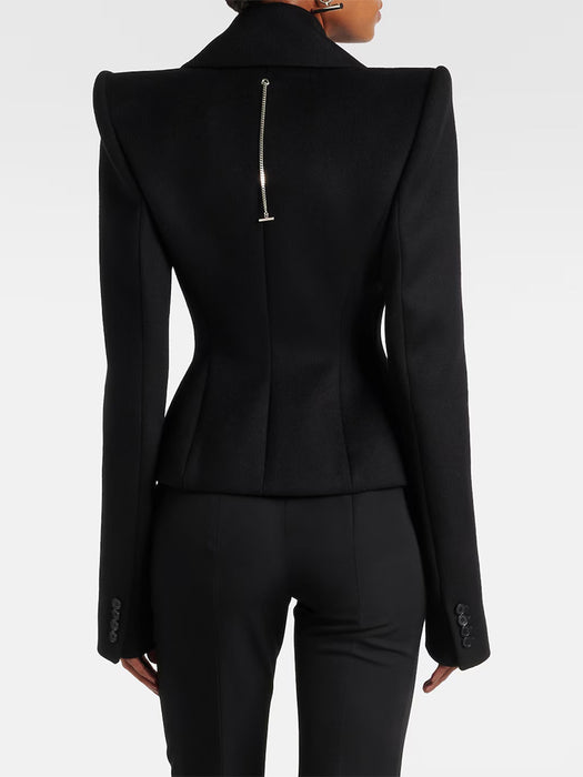 Black suit jacket and pants on a white background