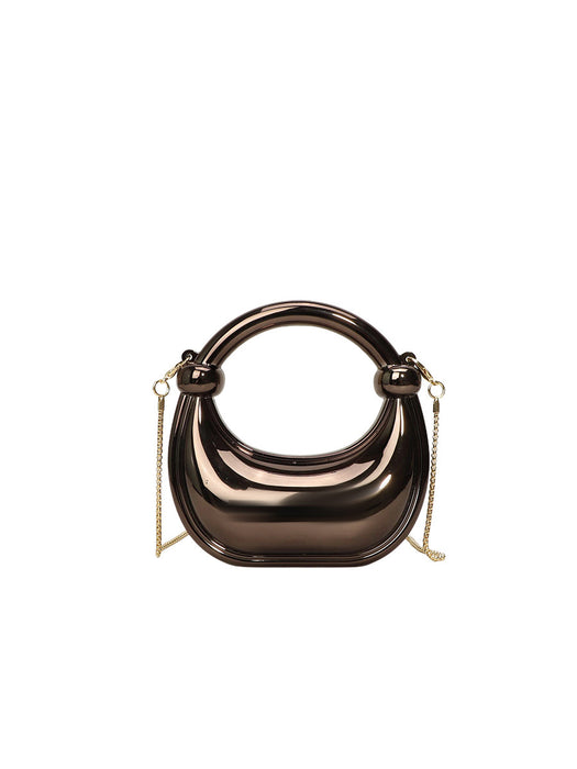 Bronze handbag with chain strap on a white background