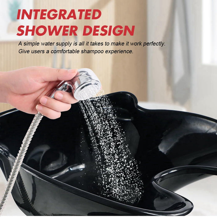 Hand using a showerhead to wash hair in a black basin with text about integrated shower design.