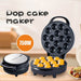 Pop cake maker with 750W rating on a wooden surface