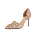 Beige high-heeled shoe with intricate gemstone embellishments on a white background