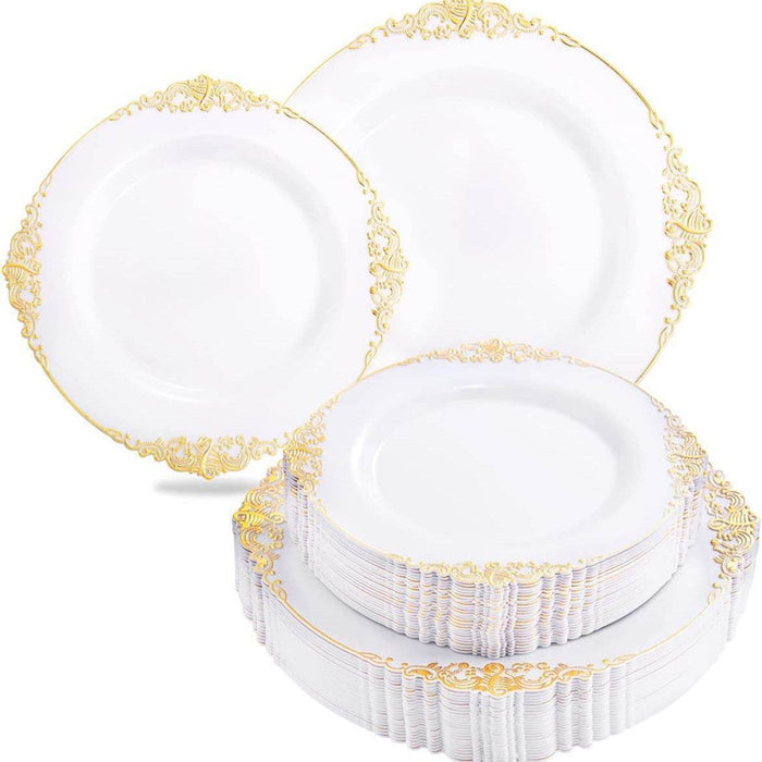 White plates with gold decorative rims stacked on a white background