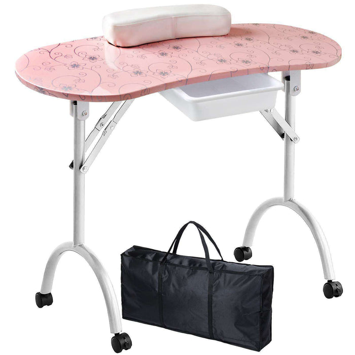 Pink nail art table with white wheels and a black carrying bag on a white background