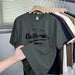 Green t-shirt with 'California' text on a hanger against a clothing rack background