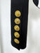 Black coat with gold buttons on a white background