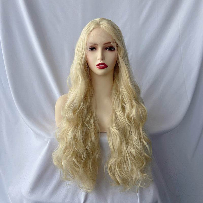 Blonde wig on a mannequin head against a white background