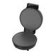 Black waffle maker on a white background
