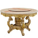 Decorative round table with marble top and gold ornate base on a white background