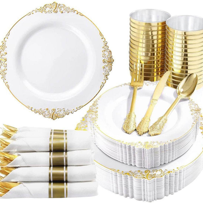 Gold and white party supplies including plates, cups, and cutlery on a white background.