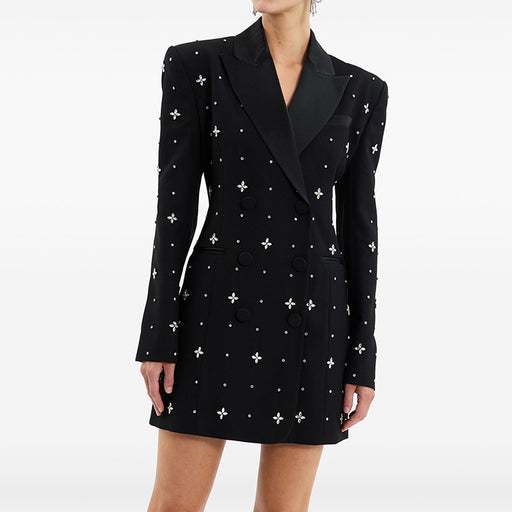 Black blazer dress with white cross patterns on a white background