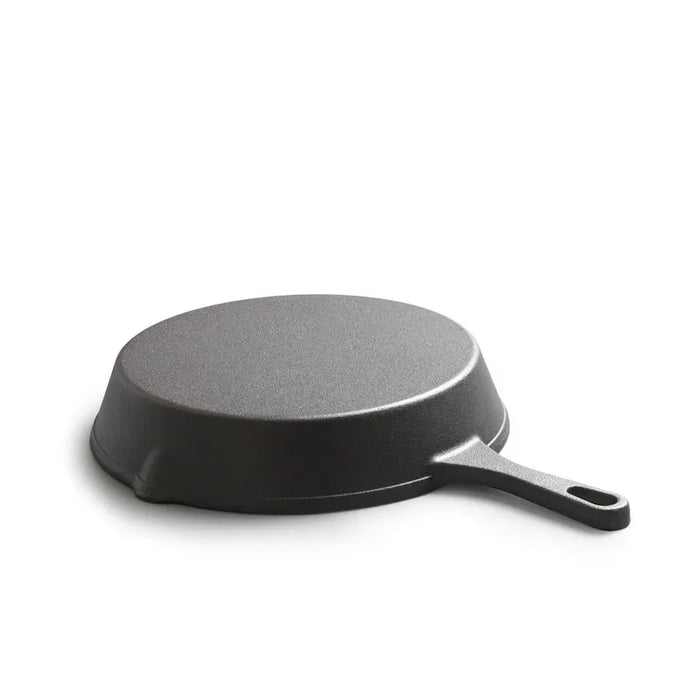 Black frying pan on a white background