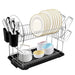 Dish rack with plates, bowls, and utensils on a white background