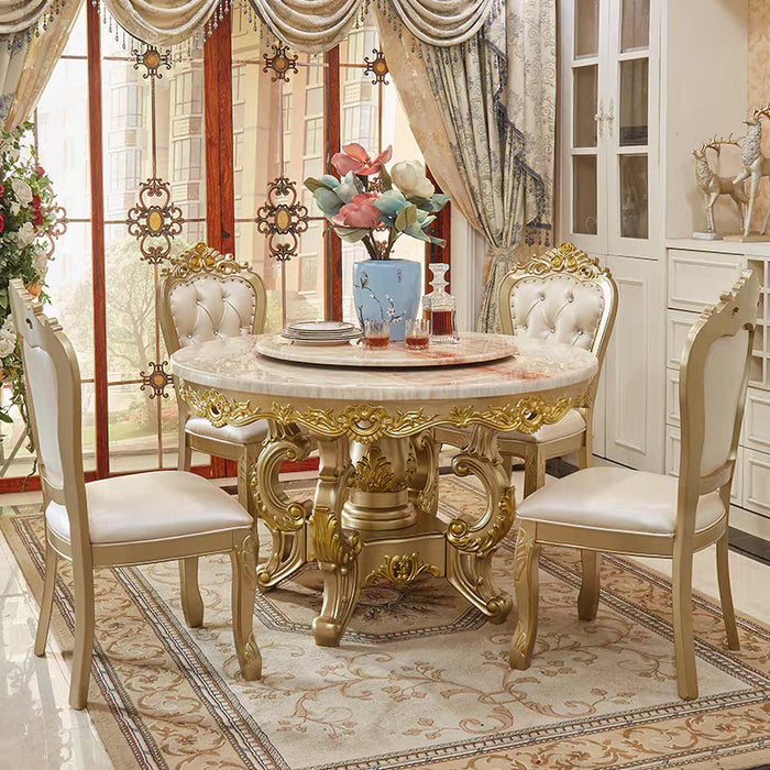 Elegant dining room with a gold and marble table and chairs.