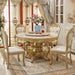 Elegant dining room with a gold and marble table and chairs.