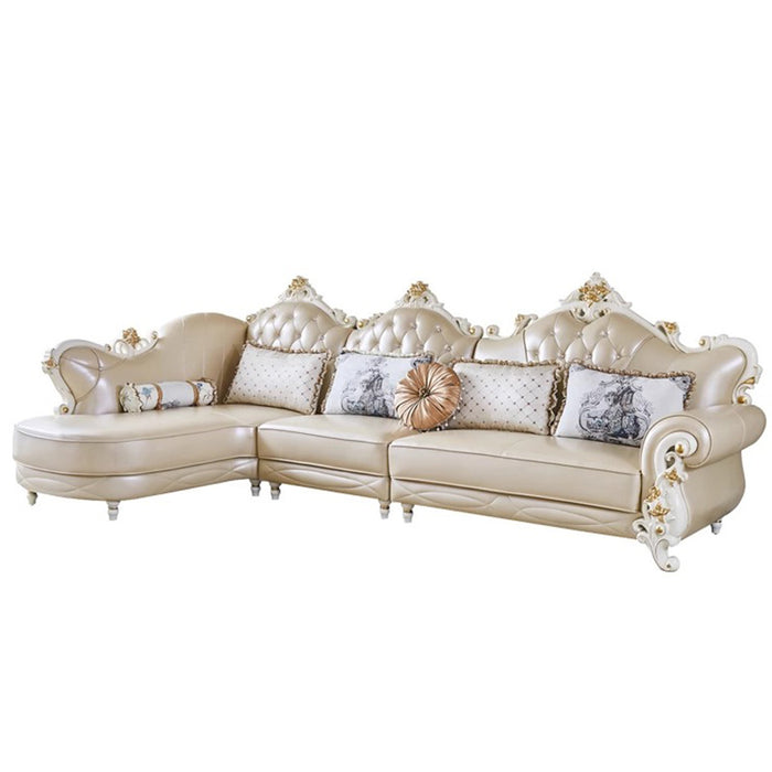 Beige sectional sofa with decorative pillows on a white background