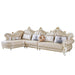 Beige sectional sofa with decorative pillows on a white background