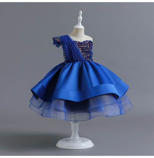 Blue dress on a mannequin against a gray background